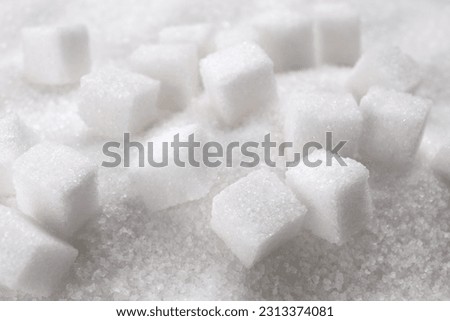 Different types of white sugar as background, closeup