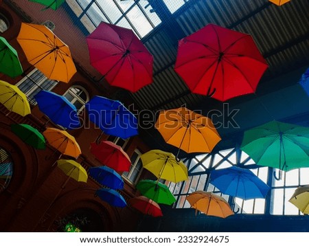 Different umbrellas hanging from the ceiling in Kassel