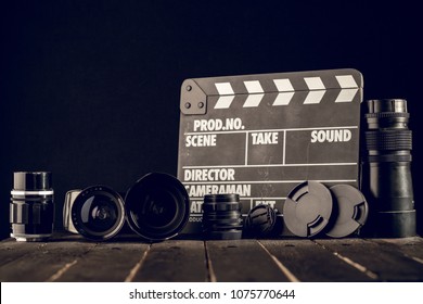 Different Video Making Equipment On Brown Wooden Table With Copy Space. Indie Movie Production Essentials