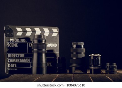 Different Video Making Equipment On Brown Wooden Table With Copy Space. Indie Movie Production Essentials