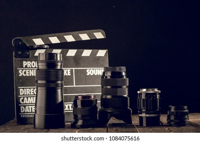 Different Video Making Equipment On Brown Wooden Table With Copy Space. Indie Movie Production Essentials