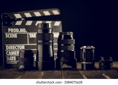 Different Video Making Equipment On Brown Wooden Table With Copy Space. Indie Movie Production Essentials