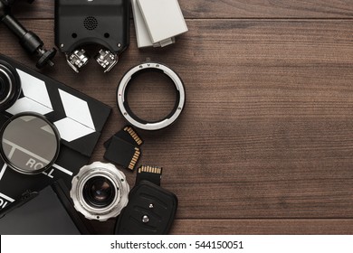 different video making equipment on brown wooden table - Shutterstock ID 544150051