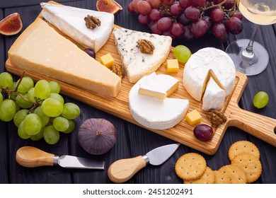 Differnt kind of cheese on the wooden board . Top view - Powered by Shutterstock