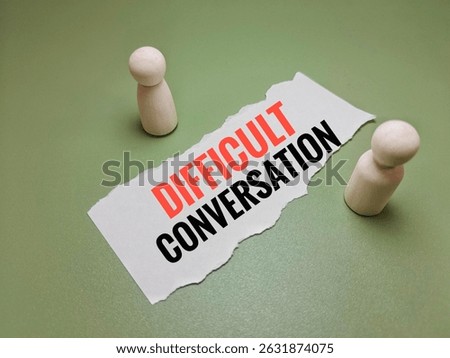 Difficult Conversation Text on Piece of Paper with Wooden Dolls – Concept of Communication Challenges, Emotional Conflict, Relationship Issues, and Honest Dialogue. 