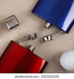 Diffirent colors stainless flask. Concept shot, top view. Custom background flask view. Flask and accessories.
