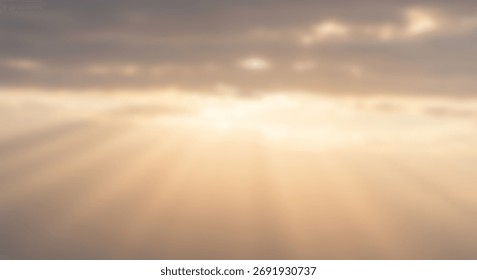 Diffuse sunlight streams through hazy clouds creating soft atmospheric rays
