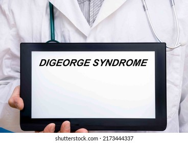 Digeorge Syndrome.  Doctor With Rare Or Orphan Disease Text On Tablet Screen Digeorge Syndrome