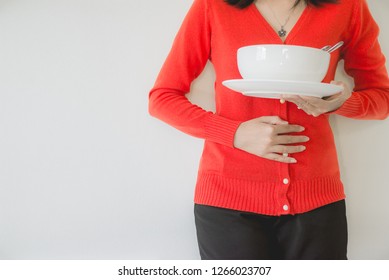 Digestion Problems,Woman With Stomach Pain After Eating,Hand Female Holding Her Belly,Do Not Eat On Time,NCDs Concept,Difficulty In Digesting Food.
