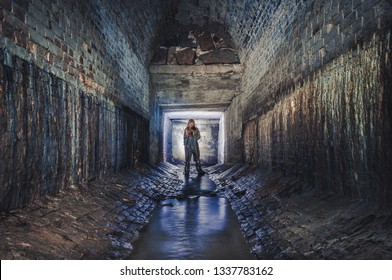 Digger Exploring Underground Sewer Tunnel 