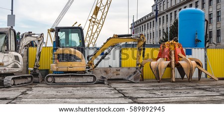 Diggers on Construction Site During Break
