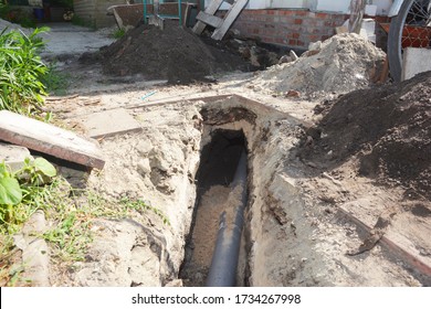 Digging A Trench For A Main Drain Pipe, Sewer Line To A Sewer Or Septic Tank. Sewer Line Replacement Or Repair.