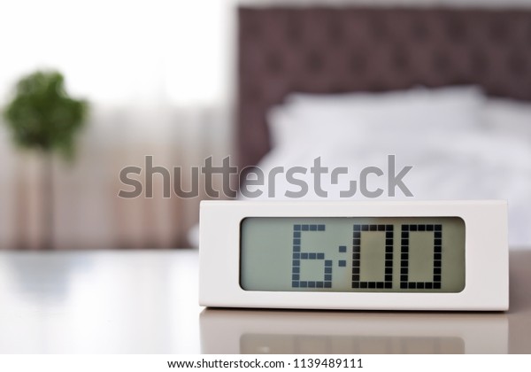Digital Alarm Clock On Table Bedroom Stock Photo Edit Now