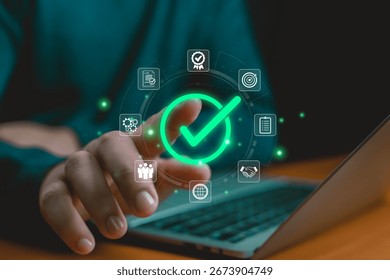 Digital approval and task completion concept with glowing green check mark icon, symbolizing business success, quality assurance, workflow efficiency, agreement, and project achievement Hand shows