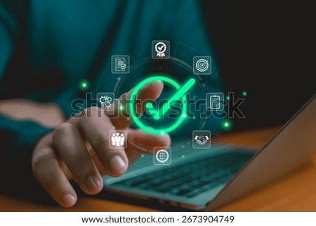Digital approval and task completion concept with glowing green check mark icon, symbolizing business success, quality assurance, workflow efficiency, agreement, and project achievement Hand shows