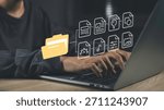 Digital archiving and file organization with document management systems (DMS). Hands typing on a laptop with digital folders and files organized storage, cataloging, and easy data retrieval.