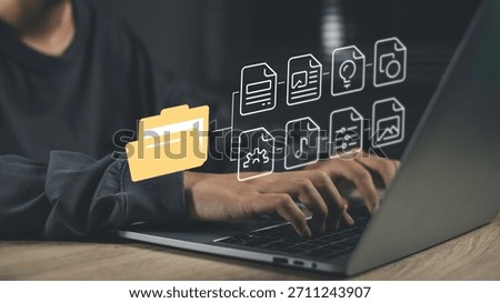 Digital archiving and file organization with document management systems (DMS). Hands typing on a laptop with digital folders and files organized storage, cataloging, and easy data retrieval.