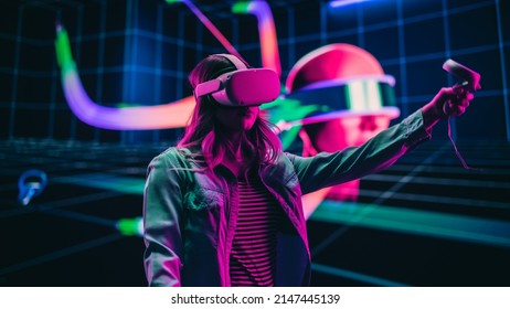 Digital Artist Making Presentation of a Modern VR Software for Producing 3D Art Pieces. Female Designer Uses Headset and Controllers to Showcase Functionality on a Big Screen on Stage.