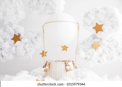 Digital background for newborn and children photography. White hand made air balloon in the clouds with the stars. White clouds. Valentines day decorations.