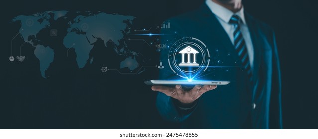 Digital banking, internet payments, and online shopping technologies in the realm of financial technology. A businessman uses a laptop to make mobile banking for online related technology icons.