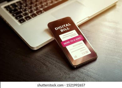 Digital Bill On Smartphone Screen, Internet Banking Concept. Electronic Digital Receipt Or Invoice On Mobile Phone Screen With A Laptop In The Background. Online Money Transaction With Phone.