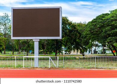 Digital Blank Scoreboard At Football Stadium With Running Track In Sport Stadium In Outdoor ,Advertising Billboard LED, Empty Black Screen Digital.