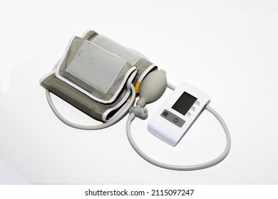 Digital Blood Pressure Monitor With Cuff. Isolation On White.