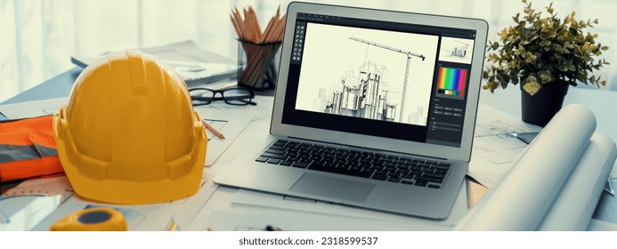 Digital blueprint by architecture design software on laptop screen with documents and blueprint layout on office table seamless integration of technology and traditional drafting method. Insight - Powered by Shutterstock