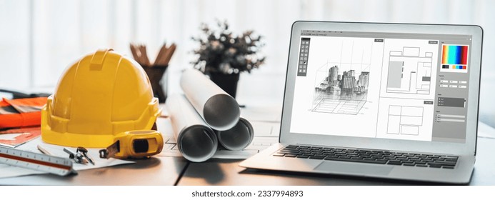 Digital blueprint by architecture design software on laptop screen with documents and blueprint layout on office table seamless integration of technology and traditional drafting method. Insight - Powered by Shutterstock