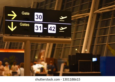 Digital Bulletin Board With Airport Gateway Signs, Night