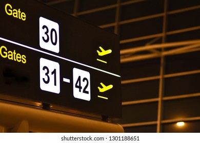 Digital Bulletin Board With Airport Gateway Signs, Night