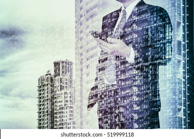 Digital Business Revolution Concept. Double Exposure Of Business Man Using Smart Phone And Abstract Digital Coding On Building. Blue Tone.