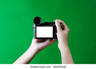 The digital camera in hand