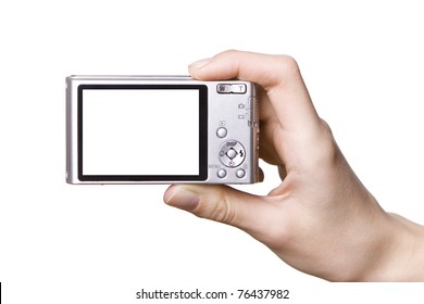 The Digital Camera In A Hand, Isolated On White