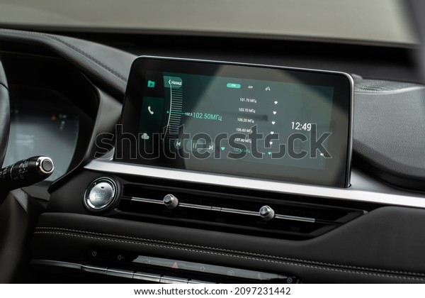 Digital car radio. Modern car radio in car. Smart\
multimedia touchscreen\
system.