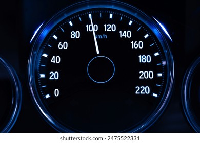 Digital car speedometer needle, high speed 100 kilometers per hour. Technology and transportation concepts