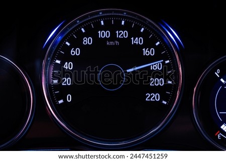 Digital car speedometer needle, high speed 180 kilometers per hour. Technology and transportation concepts
