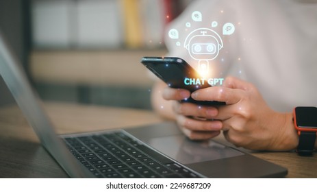 Digital chatbot, chat GPT, robot application, conversation assistant, AI Artificial Intelligence concept. Man using mobile smart phone, with digital chatbot on virtual screen - Shutterstock ID 2249687209