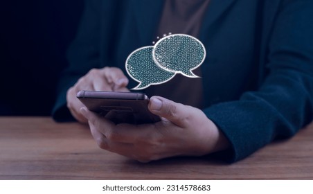Digital chatbot, chat robot application, conversation assistant, AI Artificial Intelligence concept. Man using mobile smart phone, with digital chatbot on virtual screen. Hand typing  Live Chatting. 