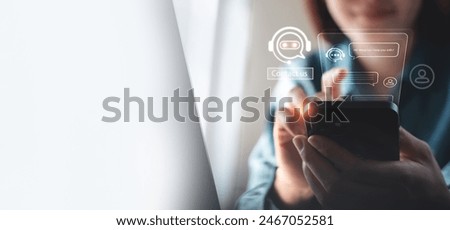 Digital chatbot conversation assistant with AI artificial intelligence technology providing virtual assistant, customer support. Business woman using mobile phone with chatbot automatic answering