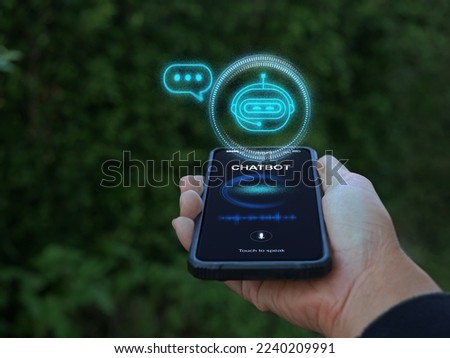 Digital chatbot, conversational agents, robot application, conversation assistant mimic human speech. Hand holding smartphone with chatterbot on virtual screen. AI Artificial Intelligence technology