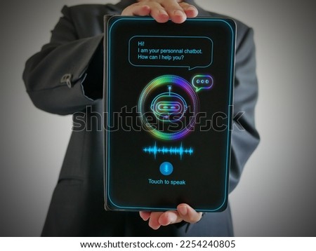 Digital chatbot, conversational agents, robot application, conversation assistant that mimic human speech. Hand holding a tablet with digital AI chatterbot on virtual screen for online information. 