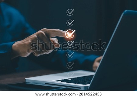 Digital checklist with completed tasks displayed above a laptop, representing workflow management, productivity, quality control, business efficiency, compliance, and successful execution.