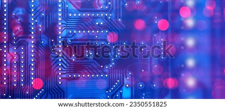 Digital circuit board in neon light. PCB background. Computer board. Motherboard with holes. Background with digital circuit board. Blue-violet PCB. Wallpaper with computer spare part. 