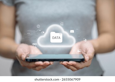 Digital cloud with data folder icon floating above smartphone, concept of cloud computing, storage, and data transfer.