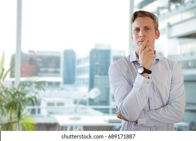 Digital Composite Of Business Man Thinking Against Office Background