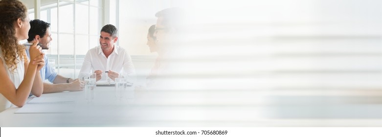 Digital Composite Of Business People Having A Meeting With Transition Effect