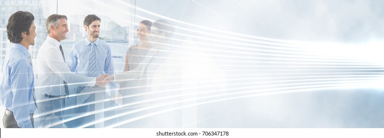 Digital Composite Of Business People Having A Meeting With Illuminated Curved Lines Transition Effect