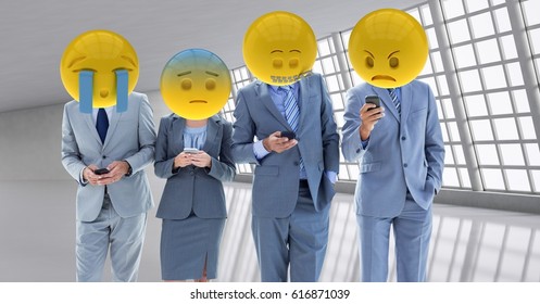 Digital composite of Business workers receiving a bad notice . Emoji heads. - Powered by Shutterstock