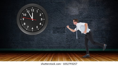 Digital composite of Businessman running with clock mounted on wall